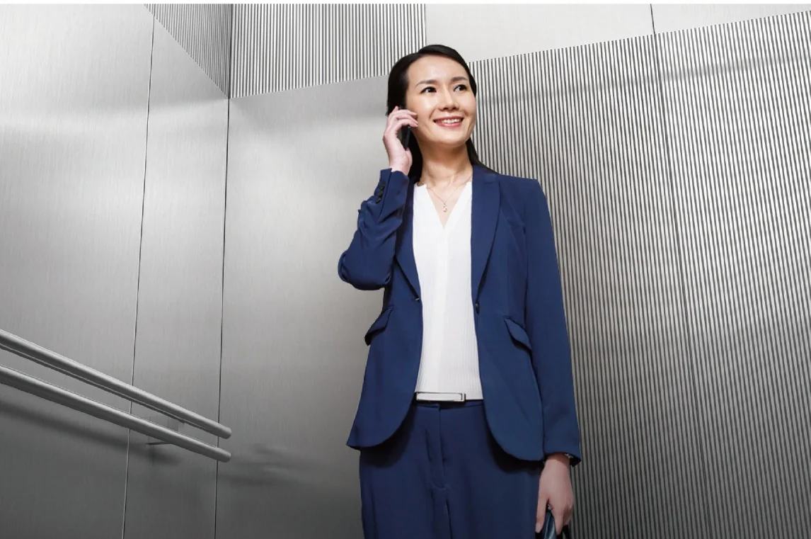 Passenger elevator interior with a business passenger